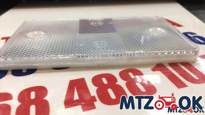 Катафот прямоугольный с отверстиями широкий (белый) 12,5х7см (пр-во Украина) Катафот прямоугольный с отверстиями широкий (белый) 12,5х7см (пр-во Украина)