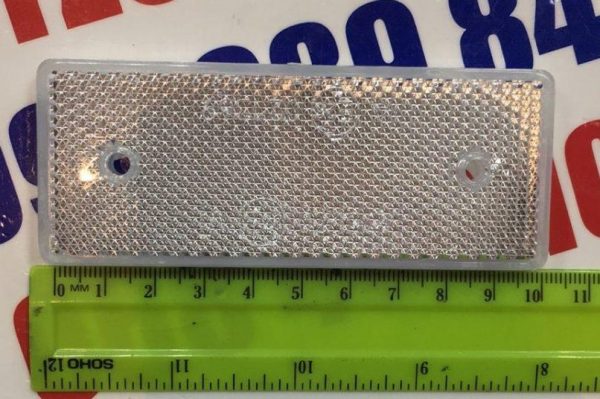 Катафот прямоугольный с отверстиями (белый) 10,2х4см (пр-во Украина) Катафот прямоугольный с отверстиями (белый) 10,2х4см (пр-во Украина)